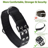 Black dog collar with metal clasp and sturdiness features on a white background