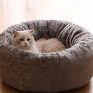 Cozy long plush cat bed features a donut round cushion mat offering fluffy winter warmth