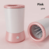 Pink and white hair tie holder with a clear lid on a pink background