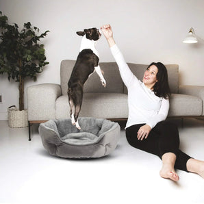 Cozy round pet bed for dogs and cats with soft padding for restful indoor sleeping comfort