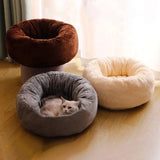 Luxurious long plush cat bed offers a donut round cushion mat with fluffy winter warmth.