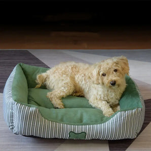 Teddy fabric dog bed for small and medium breeds with bone print and all-season comfort.