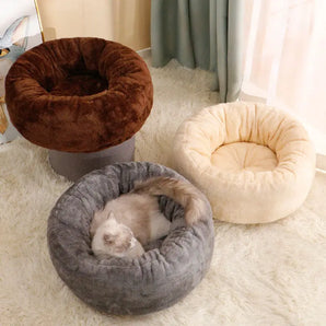 Elegant long plush cat bed with round donut provides a fluffy cushion mat for winter.