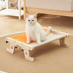 Stylish window-mounted cat hammock bed, ideal for cats to observe outdoors while staying indoors.