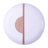 Round white and rose gold product on a white background