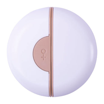 Round white and rose gold product on a white background