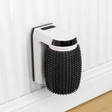 Durable automatic wall corner brush for cats to scratch and self-groom at home.