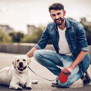 Man walking his dog using an automatic telescopic rope, providing freedom and flexibility for the pet's movement