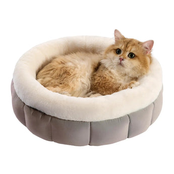 Indoor plush round cat bed with anti-slip bottom for stability.